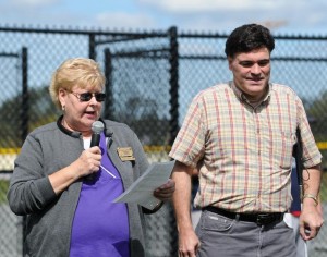 Paula Lehtola, past president of the Bridgewater Academy Lions Club, welcomes all and introduces John Oliveria, president of the Association of Blind Citizens, at the start of the Beep Ball game on a Saturday afternoon in September of 2011