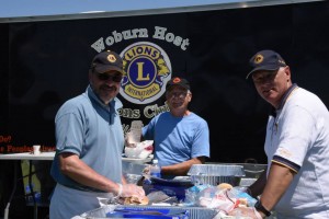 Three members of the Woburn Host Lions man  the food truck at the Beast of the East