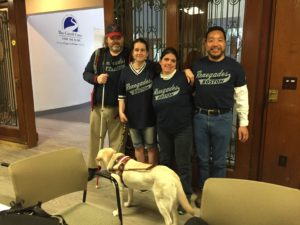 Rob, Daisy, Melissa and Yee educate the public about the beep baseball