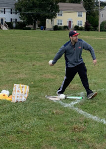 Picture shows Jacob Coiner throwing balls to the defense to give them a special spin on them