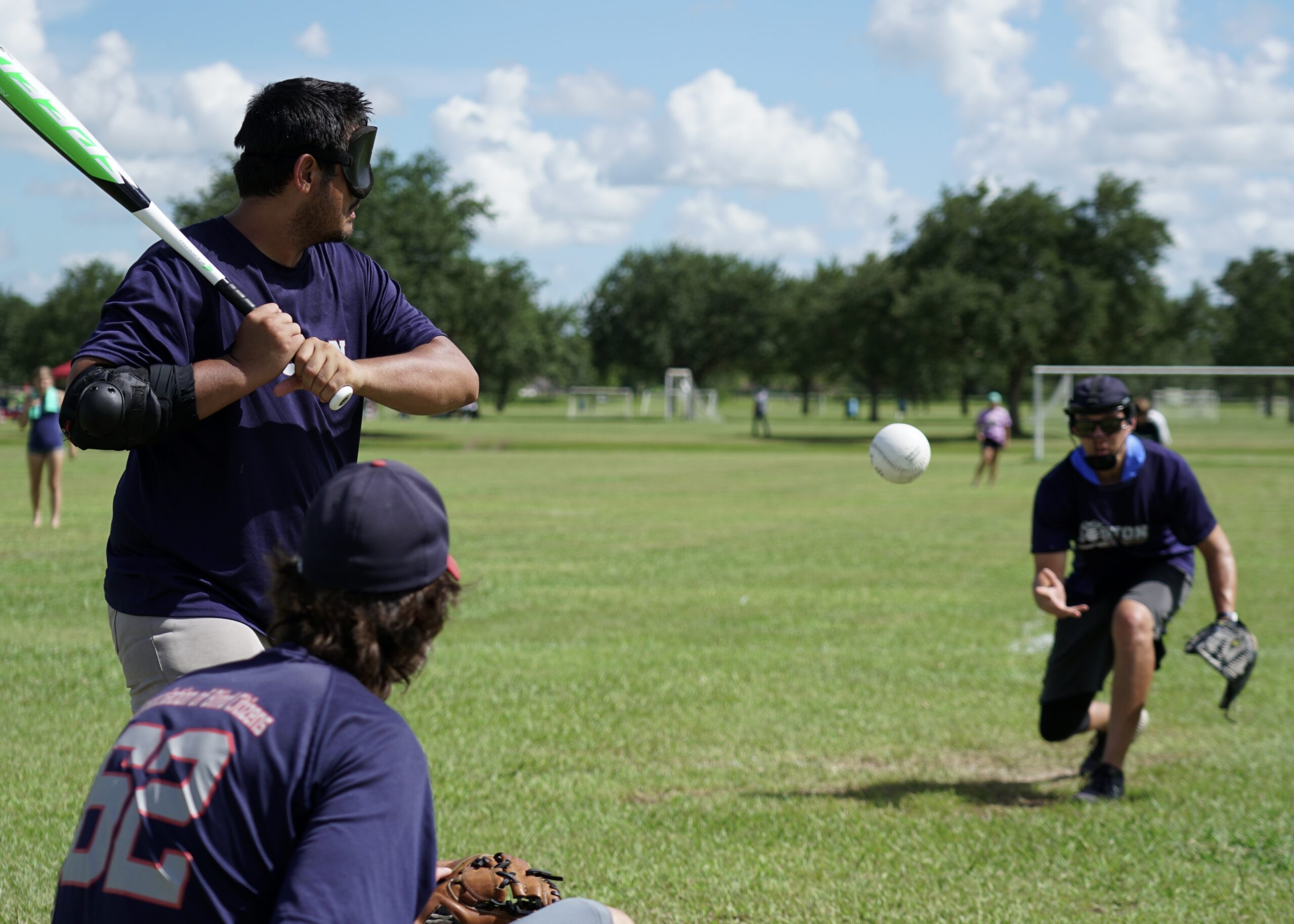 Peter Connolly delivers a pitch to his catcher, Rob Weissman with Shayne Cantan at the plate and the ball in flight