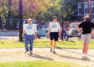 Bryan Grillo and Steve Roberts walk thru the dirt infield on a Brookline field in 2000